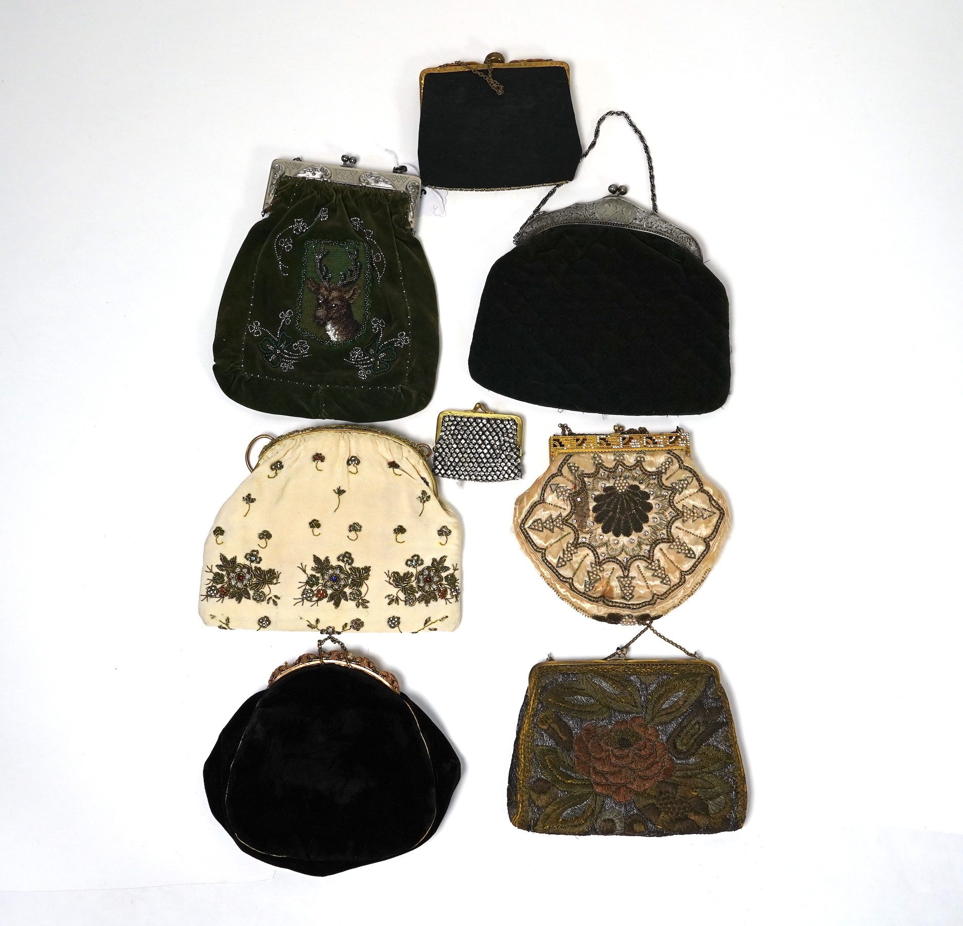 Mixed evening bags; including a 19th century velvet and cut steel handbag, a similar bag, three later gold metallic embroidered evening bags, a mixed metalic evening bag and a diamonte bag and purse (8)